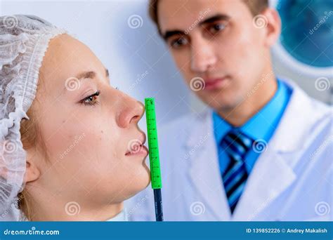 Plastic Surgery Doctor Patient Inspection And Consultation Stock Photo