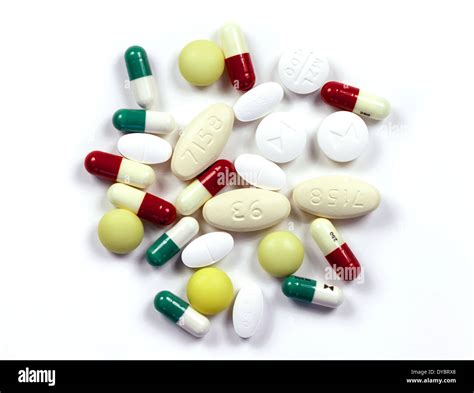 Antibiotics A Variety Of Antibiotic Capsules And Tablets On A White