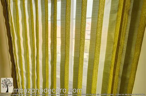 Yellow And White Striped Curtains Hanging In Front Of A Window