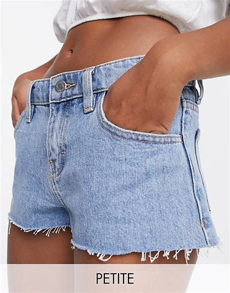 Topshop Petite Low Rise Denim Shorts In Mid Wash Asos