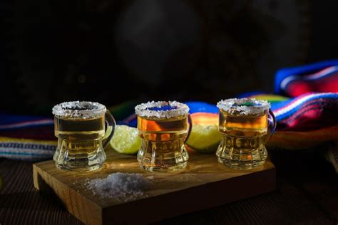 Premium Photo Tequila Shots With Salt And Lime On A Bar Table Shots