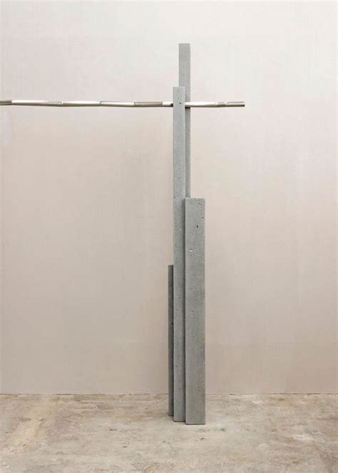 A Tall Metal Object Sitting On Top Of A Cement Floor