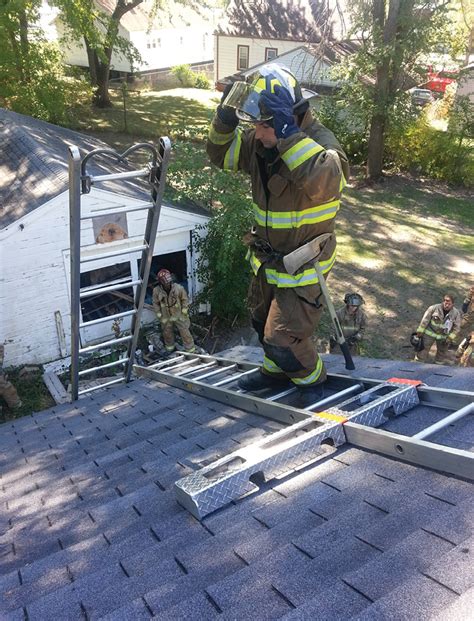 Firefighter On Roof