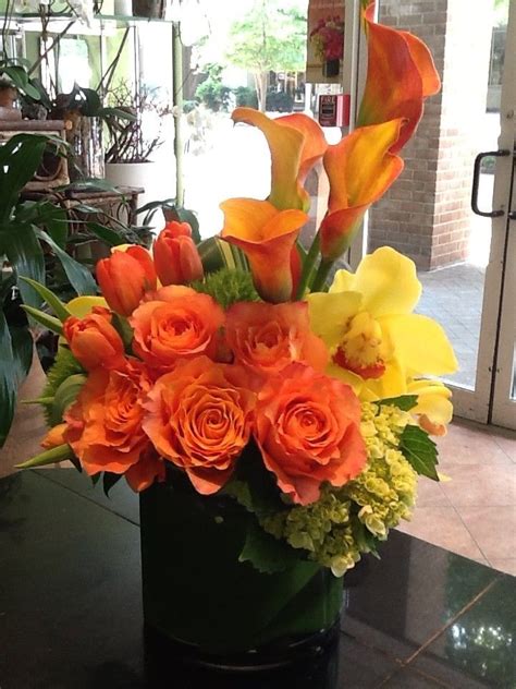 Chic Arrangement Of Yellows And Oranges With Touches Of Green In A