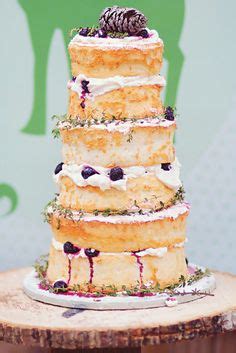 Rustic Naked Cake With Wild Berries Thyme Twigs A Pinecone Topper