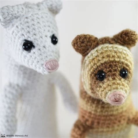 Two Crocheted Teddy Bears Standing Next To Each Other