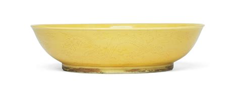 Bonhams A Yellow Glazed Incised Dragon Dish Daoguang Seal Mark And