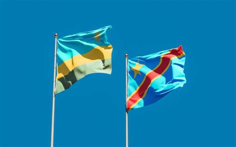 Premium Photo | Flags of rwanda and dr congo on blue sky. 3d artwork