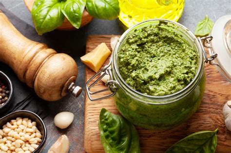 Premium Photo Homemade Pesto Sauce With Basil Leaves Pine Nuts Parmesan And Garlic