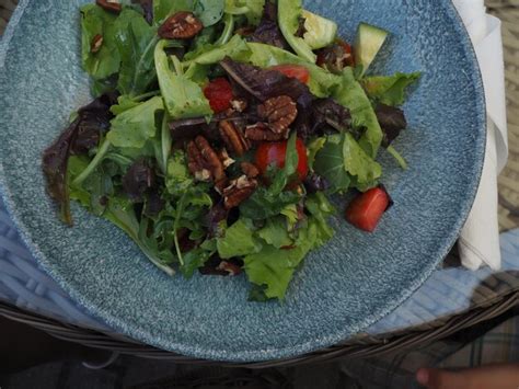 Premium Photo A Bowl Of Salad With Pecans And Avocado