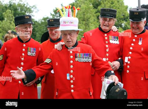 Men in red uniforms celebrating a birthday of one of them, Ascot, United Kingdom Stock Photo - Alamy