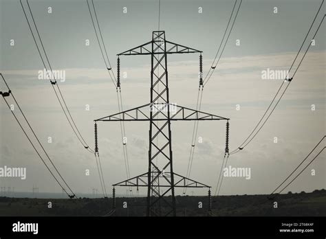 An Aerial View Of A Series Of High Voltage Electrical Towers And Power