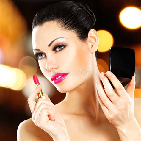 Beautiful Woman Applying Pink Lipstick On Lips Stock Photo Image Of