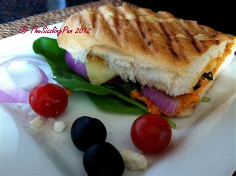 The Sizzling Pan Mediterranean Panini With Roasted Red Pepper Hummus Veggies And Feta Cheese