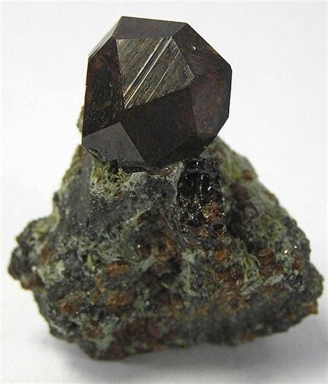 Black andradite, an end-member of the orthosilicate garnet group. | Minerals, Gems and minerals ...