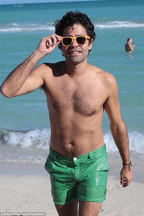 Shirtless Adrian Grenier Makes A Seaside Splash With His Bikini Clad