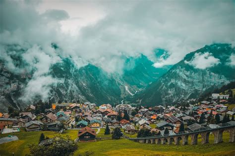 Houses near the Swiss Mountains · Free Stock Photo