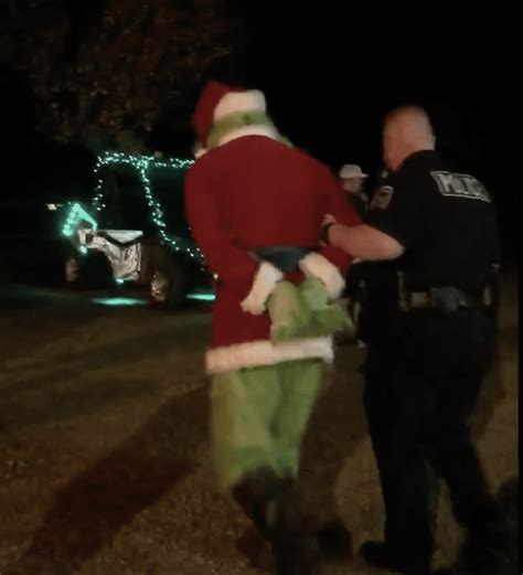 The Grinch Is Arrested By Police At A Tree Lighting Ceremony Inside