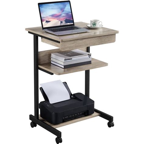 A Laptop Computer Sitting On Top Of A Wooden Desk Next To A Printer And