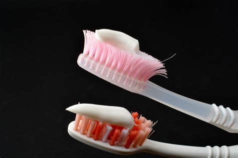 White toothpaste on a toothbrush. Black background 27719672 Stock Photo ...