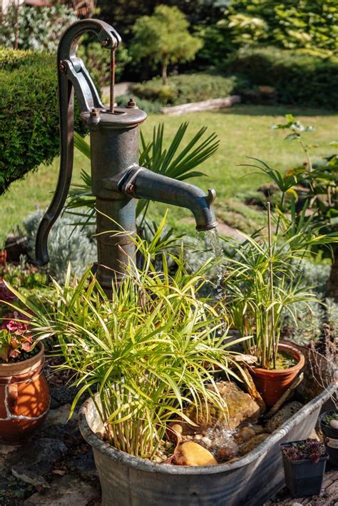 Old Water Pump Fountain In 2024 Garden Fountains Diy Garden