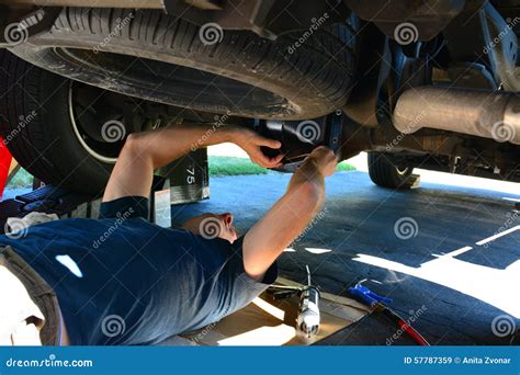 Mechanic Servicing Under A Truck Stock Photo Image 57787359