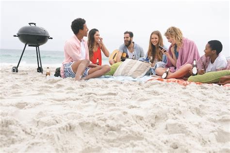 Premium Photo Group Of Friends Enjoying On Beach