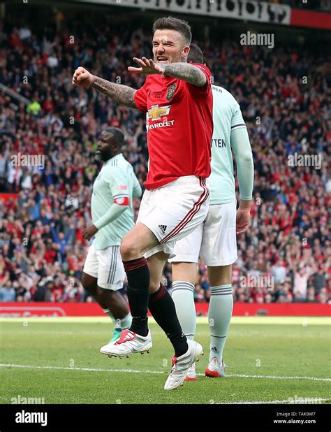 Manchester United Legends David Beckham celebrates scoring his side's ...