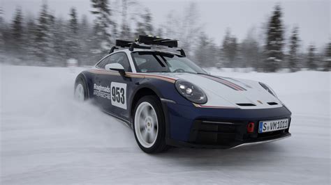 Watch The Porsche 911 Dakar Race An Olympic Skier In The Snow