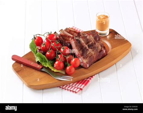 Smoked pork ribs and spicy sauce - still Stock Photo - Alamy