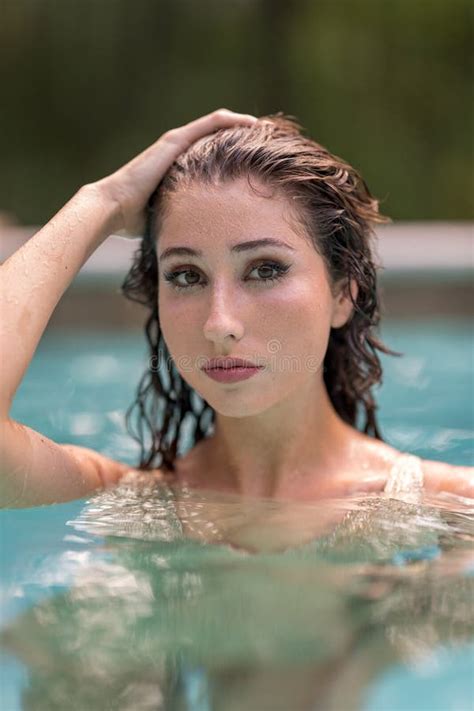 Portrait Of A Beautiful Bikini Model With Blurry Nature Background