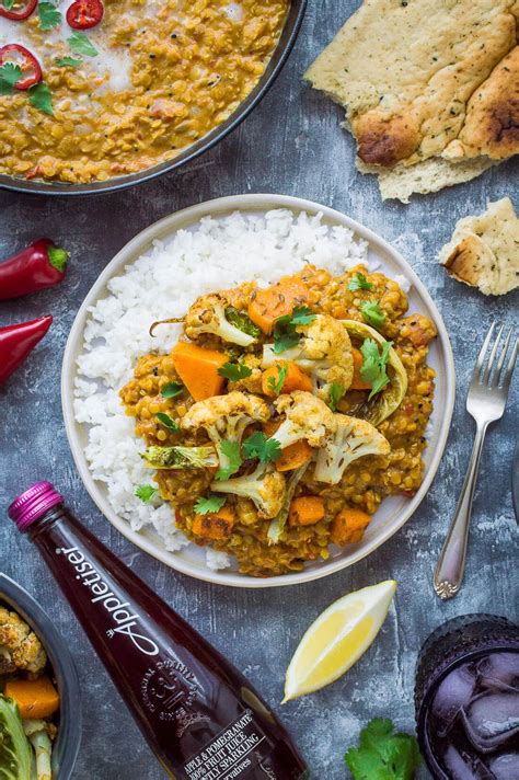 A Plate Of Vegan Red Lentil Dhal With Roasted Cauliflower And Butternut