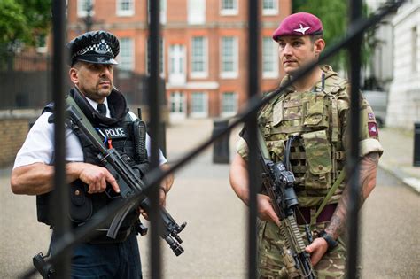 A Soldier From 2nd Battalion The Parachute Regiment With A Member Of