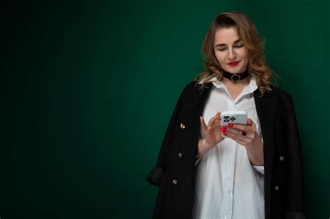 Premium Photo Woman In White Shirt Holding Cell Phone