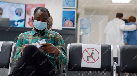 Premium Photo | Diverse patients sitting in waiting room lobby to attend checkup visit ...