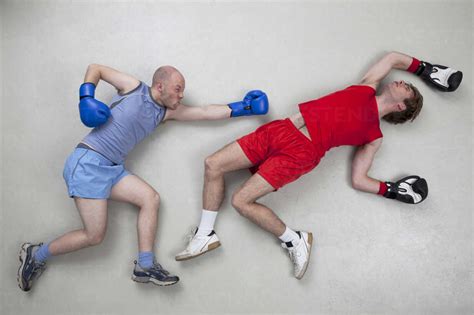 Man getting knocked out in boxing fight stock photo