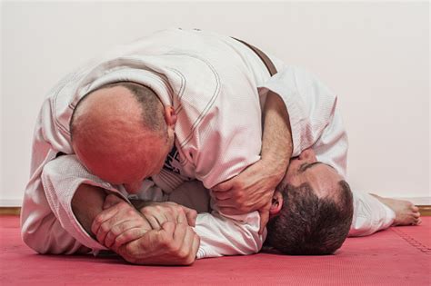 Brazilian Jiujitsu Training Demonstration In Traditional Kimono Stock