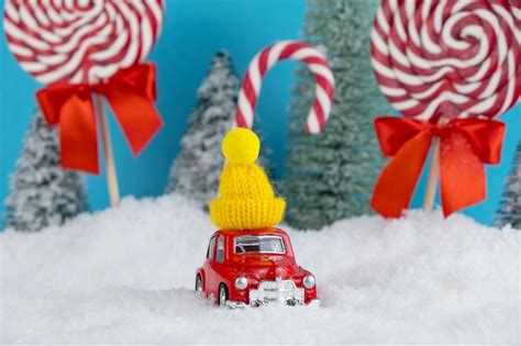 Premium Photo Red Santa Car With In Yellow Winter Cap And Christmas