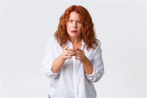 Premium Photo Portrait Of Confused Middle Aged Redhead Woman Looking