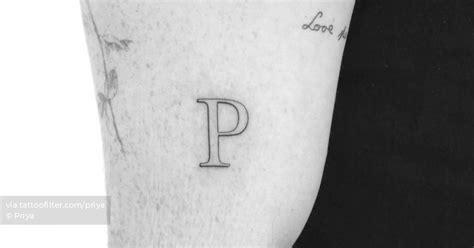 Letter P Tattoo Located On The Upper Arm