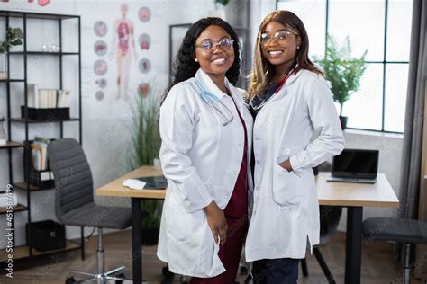 Portrait Of Two Female African American Doctors Or Nurses Colleagues