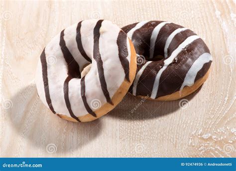 Two Glazed Ring Doughnuts on Wood Stock Photo - Image of ring, doughnut: 92474936