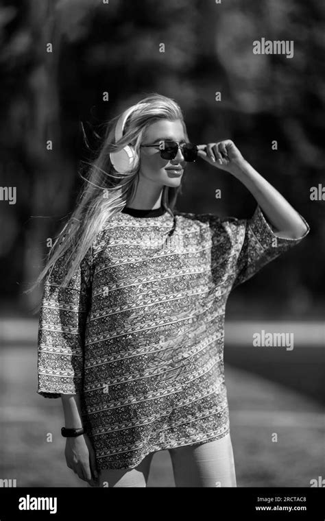 Blonde Athletic Girl Stands On The Football Field Black And White Stock Photo Alamy