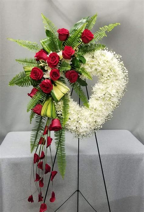 Elegant Funeral Flower Arrangements With White Wreath And Red Roses