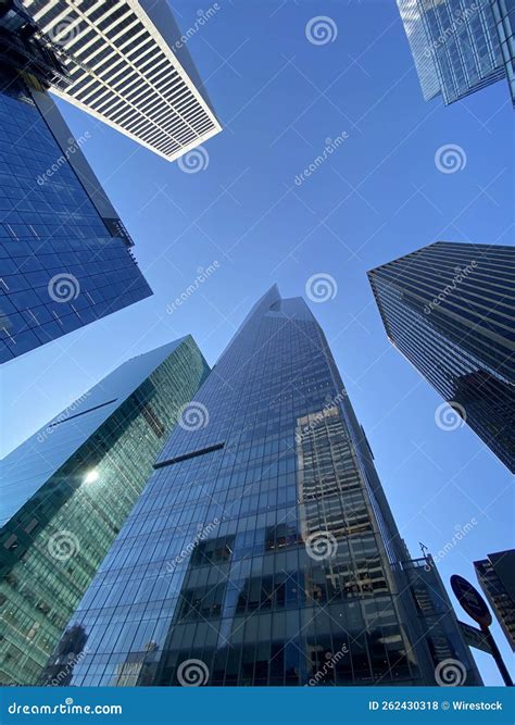 Vertical Shot Of Glass Skyscrapers In Blue Sky Background In New York