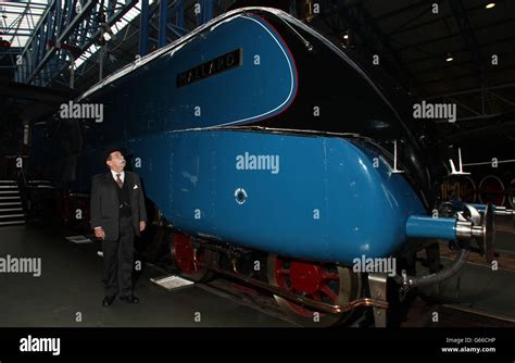 Chris Cade From Platform Theatre Dressed As Sir Nigel Gresley Next To