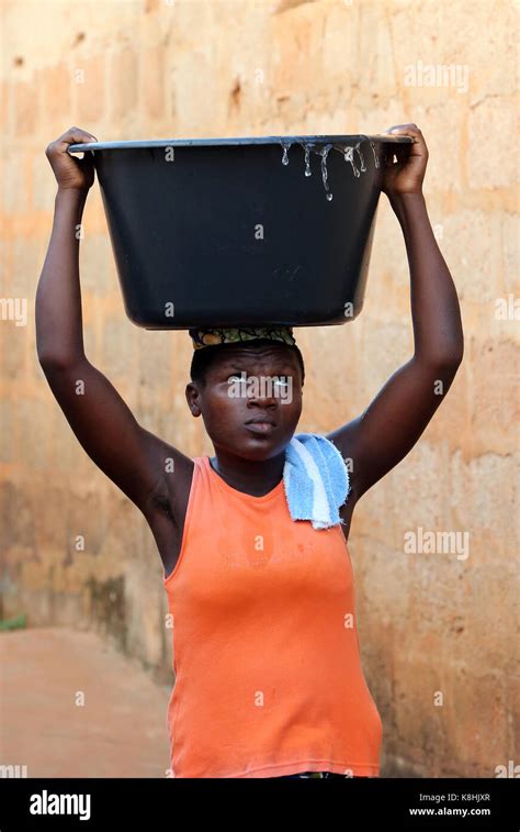 African Village Life Water Chore African Girl Carrying A Basin Of Water On Head Togoville