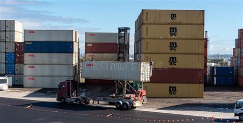 Shipping Container Storage Yard A Forklift Putting A Container On A