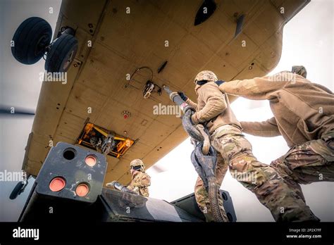 U S Army Air Defenders Attach Their Avenger Weapon System To A Chinook Helicopter During Sling