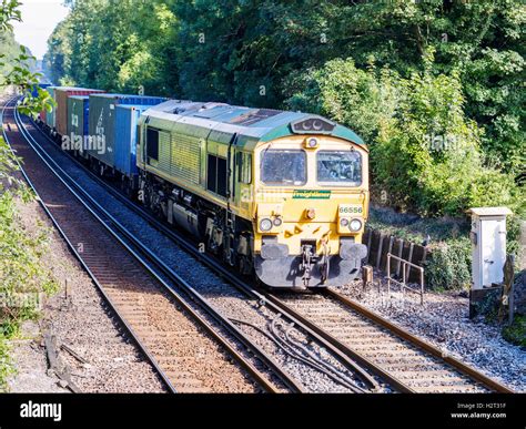 A Freightliner Container Train Hauled By A Class 66 Diesel Locomotive In Freightliner Livery